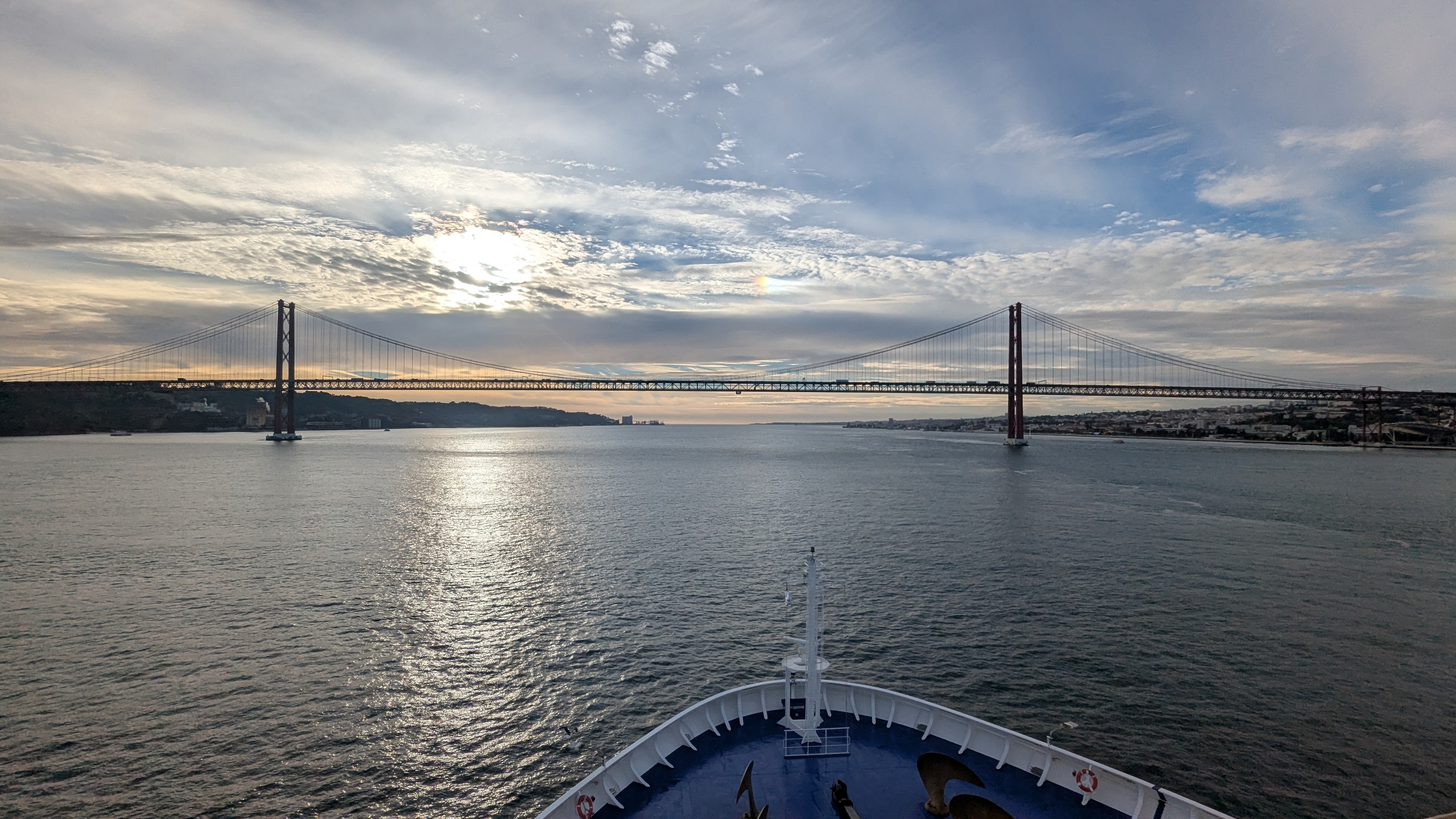 Sailing away from Lisbon under the famous bridge