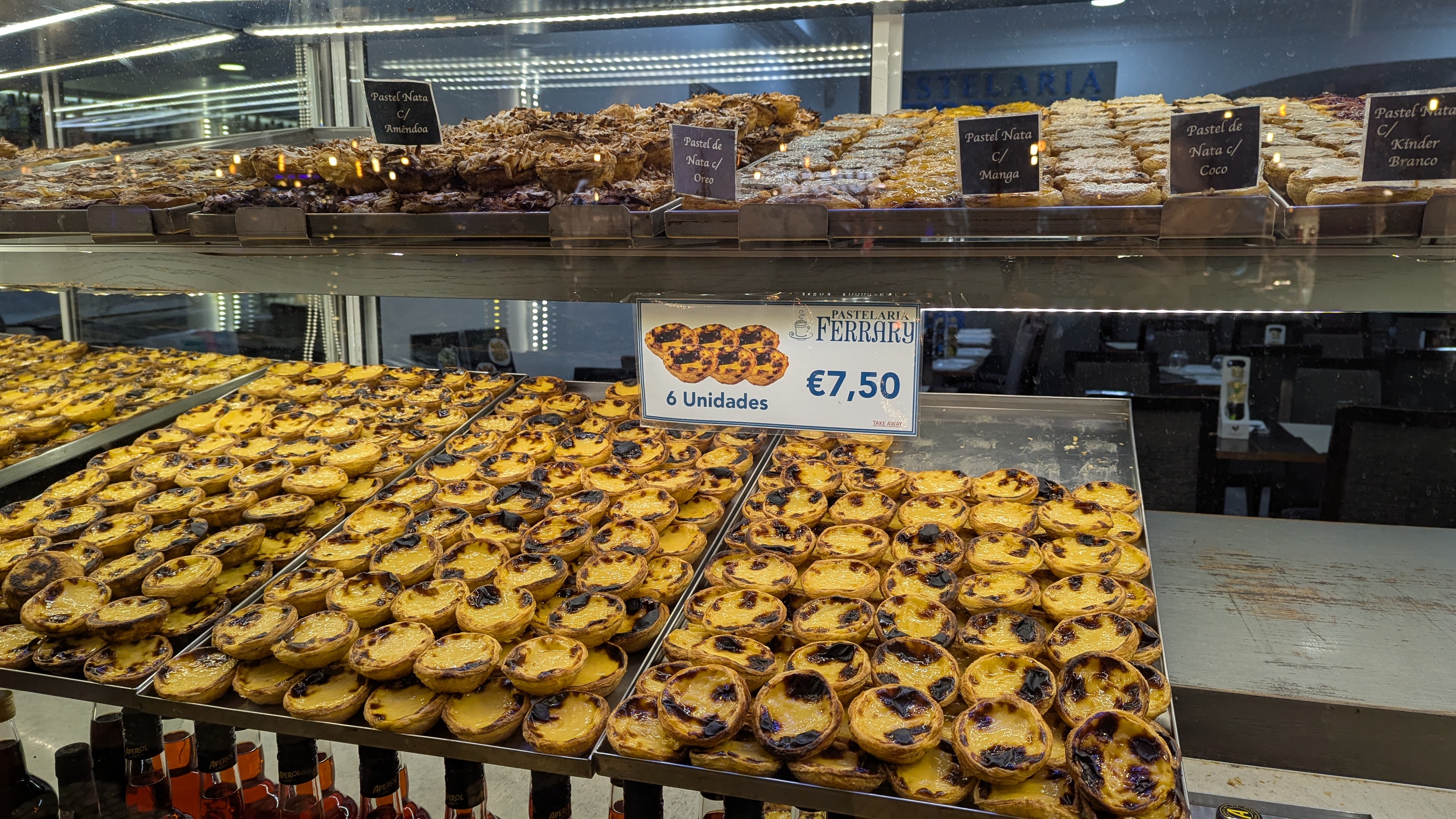 Rows of pastel de natas in a Lisbon bakery